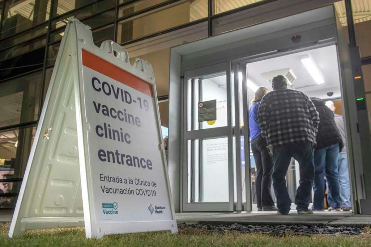 People line up at Spectrum Health on Jan. 11 as health care workers begin vaccinating adults age 65 and older. The three largest health systems in West Michigan say they are at or near capacity due to a surge of COVID-19 patients. (Photo courtesy of Chris Clark/Spectrum Health Beat)  