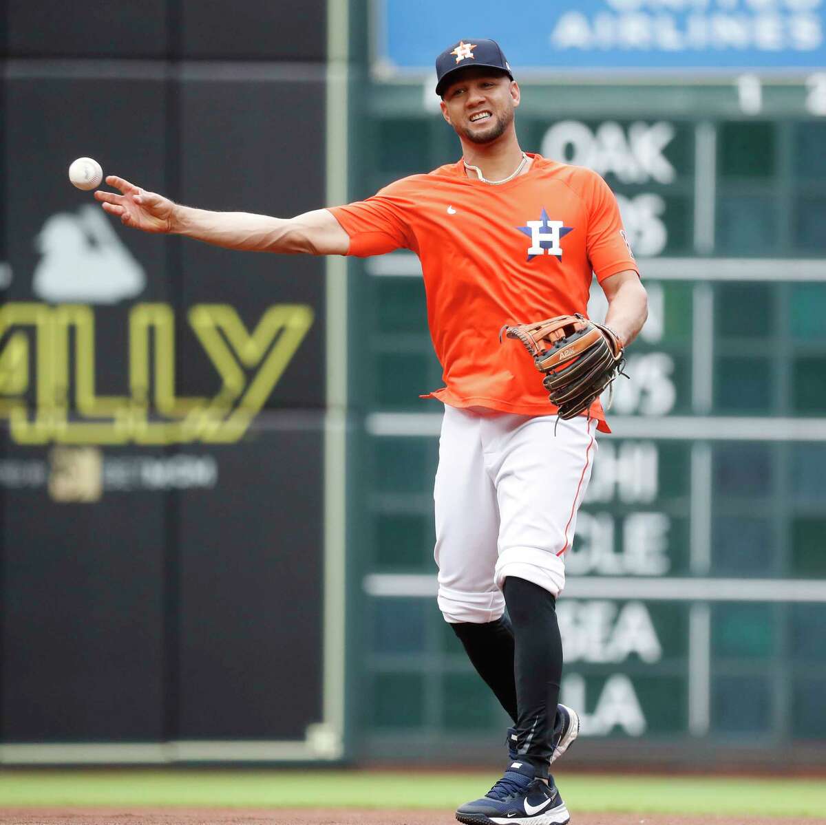 Houston Astros Yuli Gurriel takes infield practice at second base before the start of an MLB baseball game at Minute Maid Park, Thursday, May 13, 2021, in Houston.