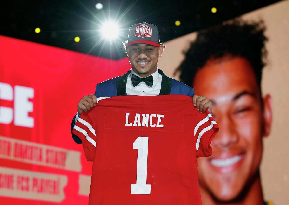 North Dakota State quarterback Trey Lance holds an NFL jersey after being chosen by the San Francisco 49ers with the third pick in the first round of the NFL football draft Thursday April 29, 2021, in Cleveland.(Jeff Haynes/AP Images for Panini)