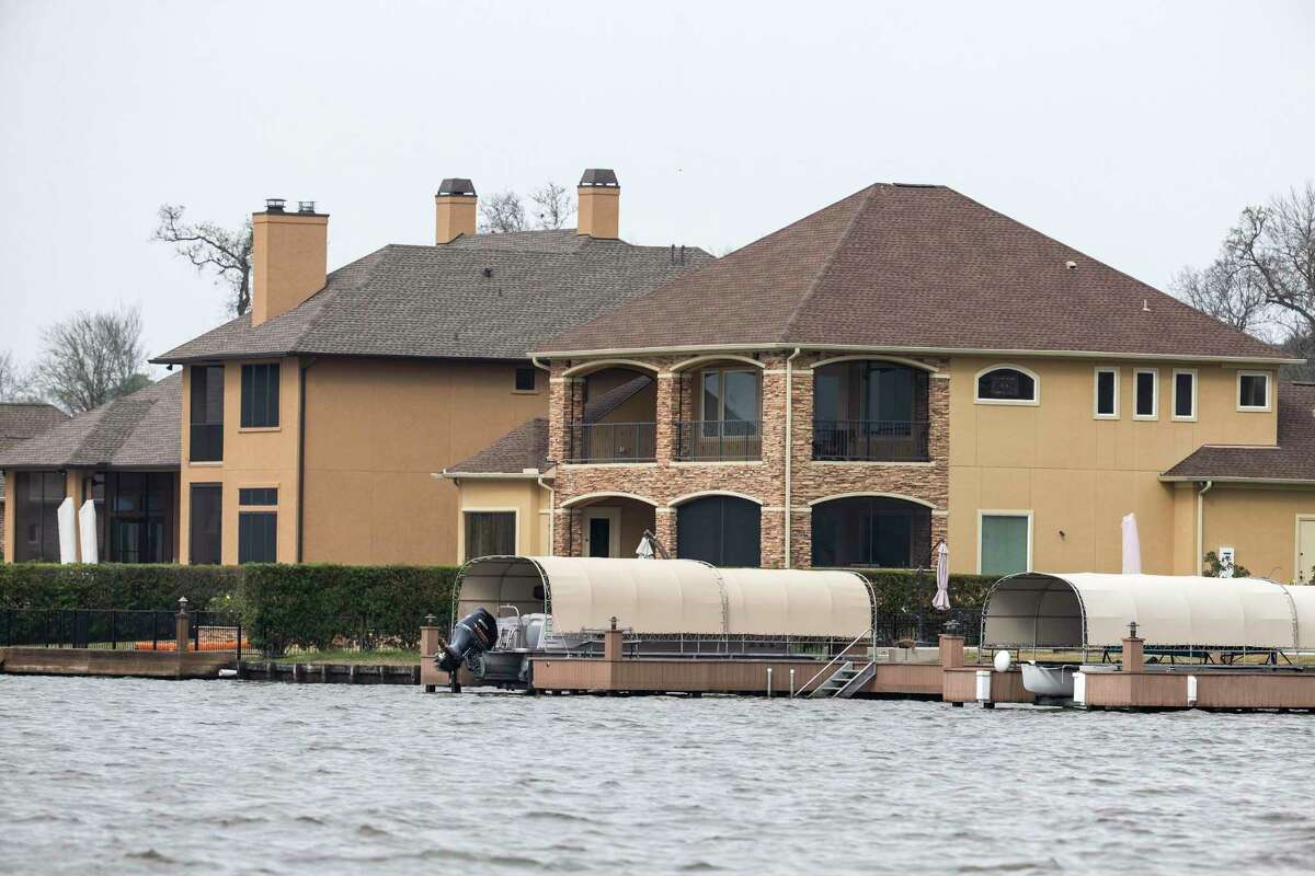 The residence reportedly owned by Lt. Gov. Dan Patrick, on Benthaven Isle on Lake Conroe, right, is shown on Tuesday, Feb. 5, 2019, in Conroe. 