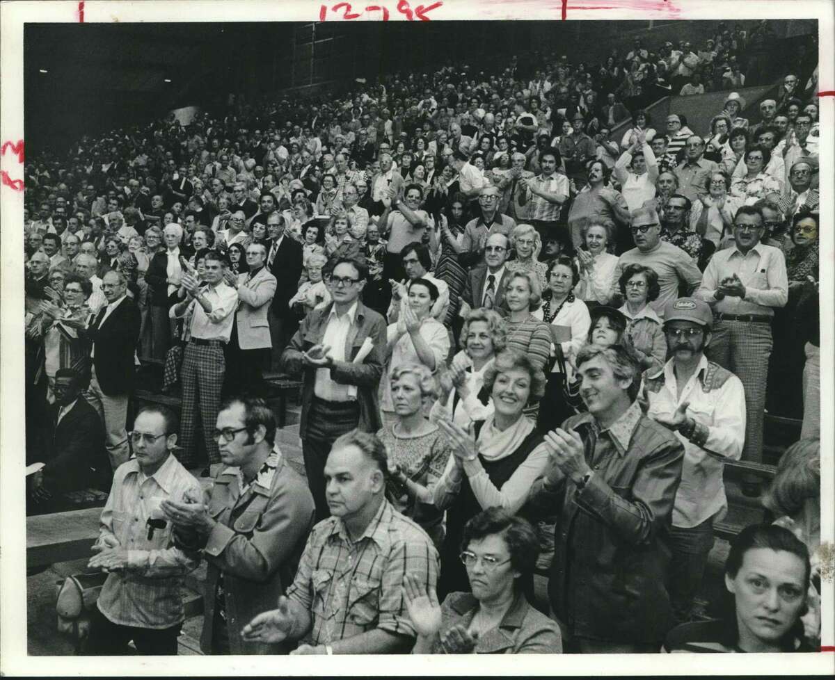 Part of crowd of 3,000 disgruntled northwest Houston taxpayers in 1978 applauds call for moratorium on city property tax revaluations until a "more equal and uniform" assessing plan is devised.