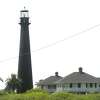 A historic lighthouse sits at the end of the Bolivar Peninsula. The area continues to see new growth and development after being devastated by Hurricane Ike. Photo taken Wednesday, April 27, 2016 Kim Brent/The Enterprise