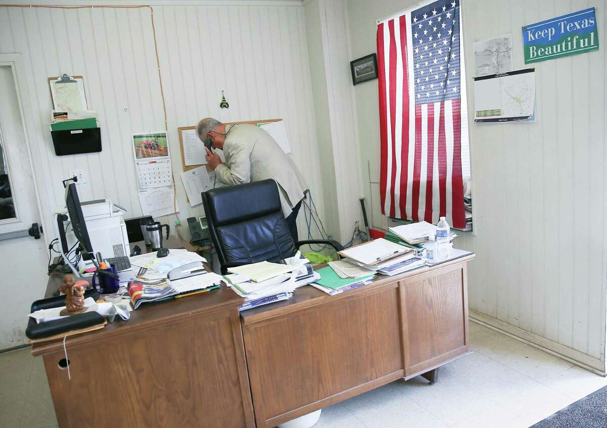 Walker County Commissioner Jimmy Henry takes a call in his office in New Waverly on Wednesday, May 5, 2021. Henry did a grassroots survey where he found nearly one in four Walker County households said they do not subscribe to home internet service.