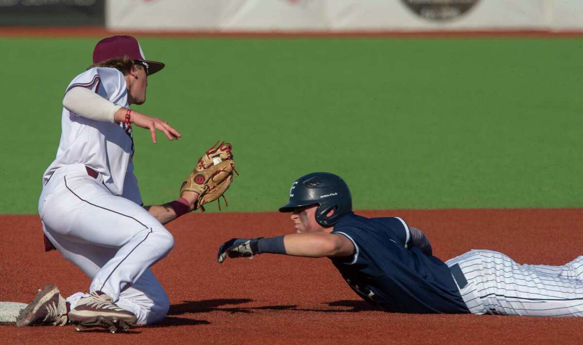Lee High's Brayden Wynne reaches to put the tag on Eaton High's Silas Voegely as he tries to steal second 05/13/2021 at Ernie Johnson Field. Tim Fischer/Reporter-Telegram