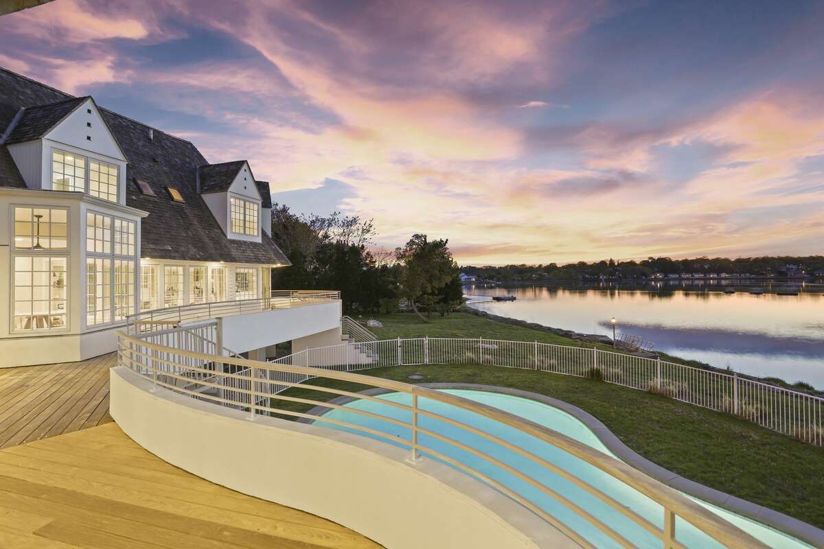 The home at 29 Brush Island Road in Darien, Conn. has 285 feet of private beachfront, the listing notes, along with its pool and floating dock that sits along the home’s beachfront. 