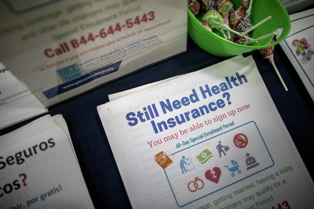 Affordable Care Act enrollment counselor Sharon Barker’s booth at a back-to-school event at the Martha O'Bryan Center in Nashville, Tenn., Aug. 4, 2017. (Joe Buglewicz/The New York Times)