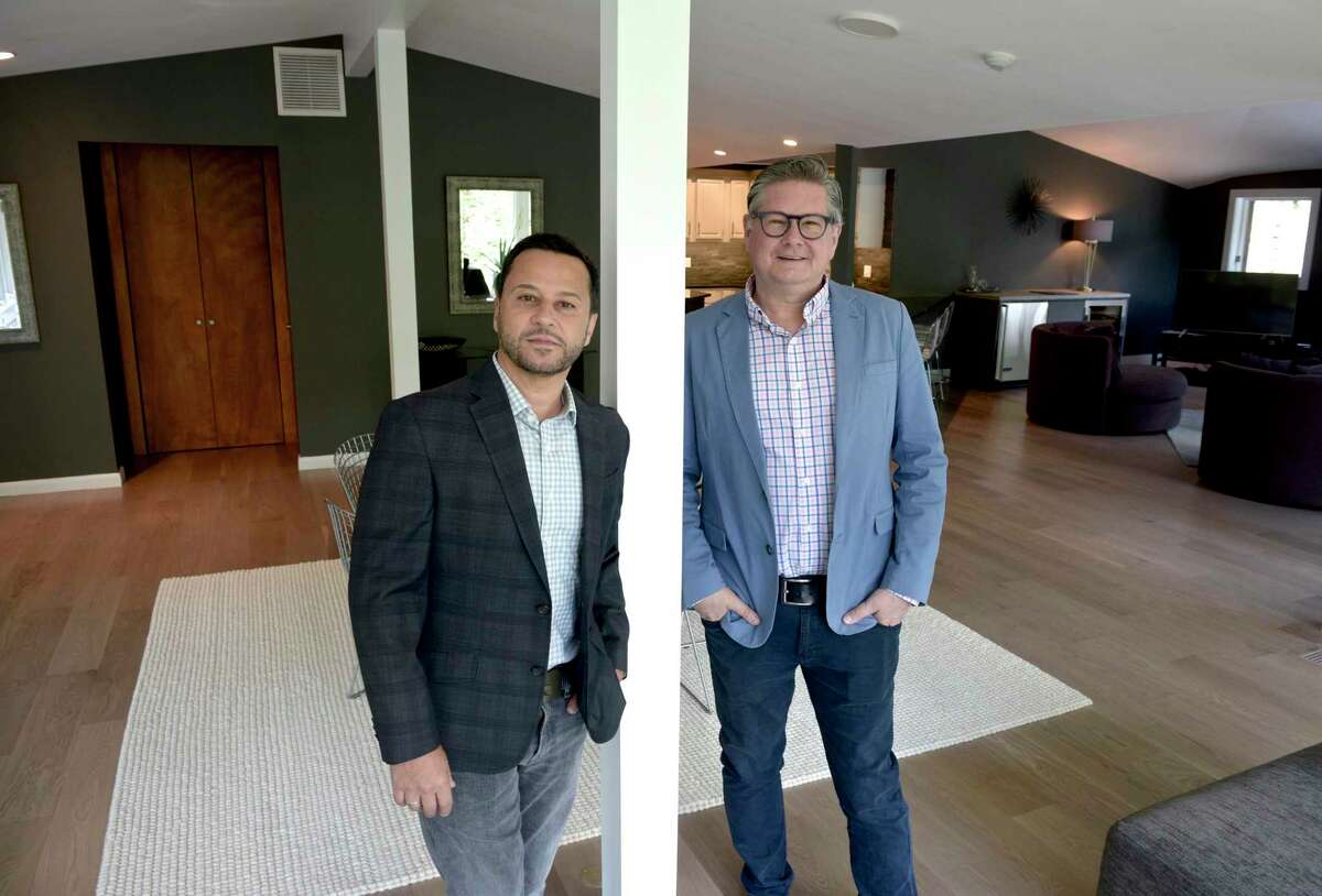 Mark Madonna, left, and Jeff Phillips from Madonna & Phillips Real Estate Group at William Pitt Sotheby’s International Realty, stand in a new listing from Roxbury, Conn, on Thursday morning, May 13, 2021.