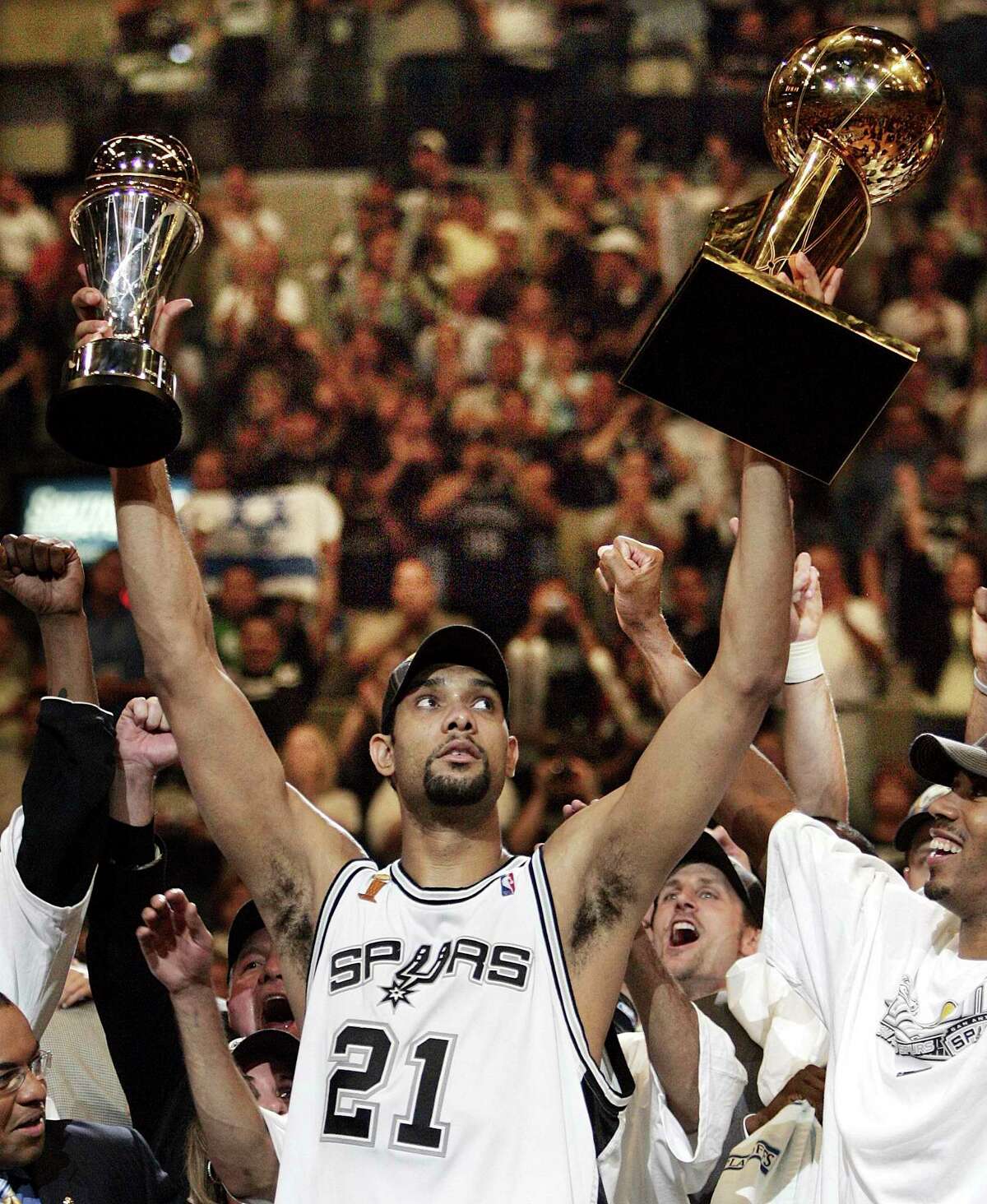 Spurs great Tim Duncan celebrates the 2005 championship and MVP. Duncan filled up the stat sheet, but he led with the heart of a champion.