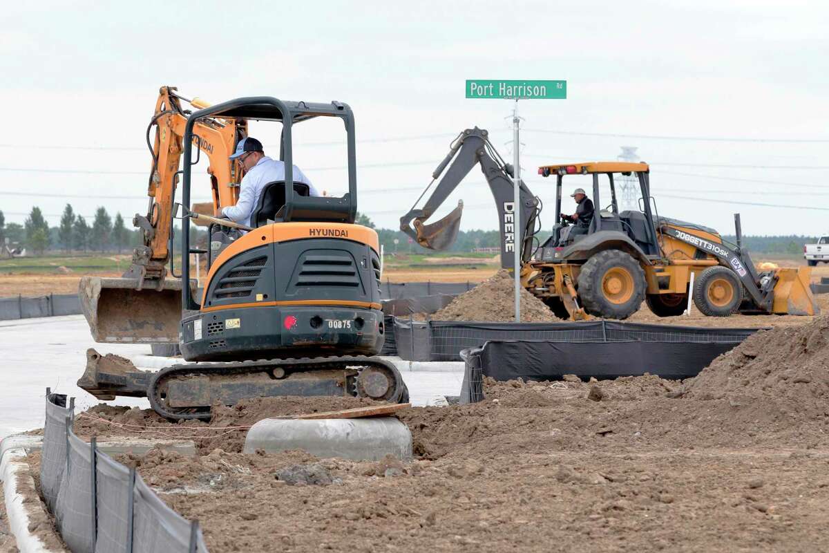Small and large backhoes move dirt near new streets as construction continues in a new subdivision northwest of the Hiway 99 and Bridgeland Creek Parkway, part of the Prairieland Village development Thursday, May. 13, 2021 in Cypress, TX.
