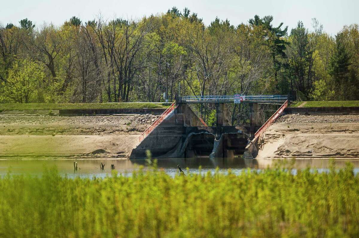 Part of Edenville Dam remains as the water level of Wixom Lake is still extremely low Friday in Edenville. (Katy Kildee/kkildee@mdn.net)