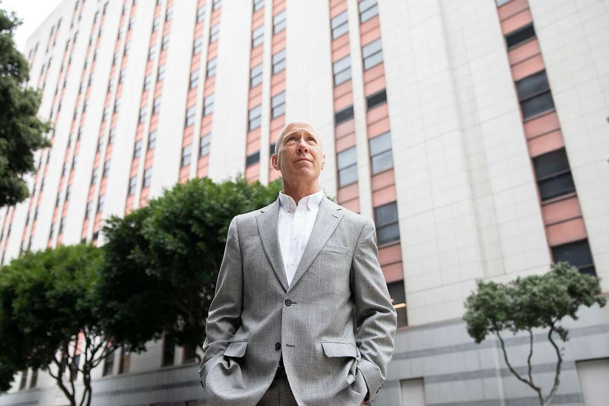 Retired Judge Bill Hanrahan stands outside of the U.S. Immigration and Customs court building in San Francisco on May 14. The former managing judge of the San Francisco immigration court delivered a blistering exit interview after retiring from the system, saying the courts are run by a “soul-crushing bureaucracy” that needs “wholesale reform.”