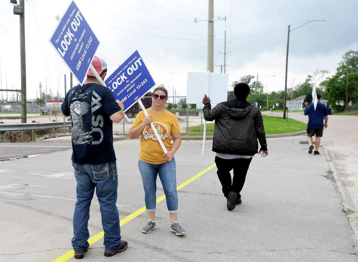 ExxonMobil and United Steel Workers Union members picket outside the plant Saturday afternoon after all the workers had been escorted out in a lockout. Photo made Saturday, May 1, 2021 Kim Brent/The Enterprise