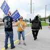 ExxonMobil and United Steel Workers Union members picket outside the plant Saturday afternoon after all the workers had been escorted out in a lockout. Photo made Saturday, May 1, 2021 Kim Brent/The Enterprise