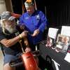 VFW Post 4820 member Jim Rose hands a specialty Navy dog tag for veteran Robert Sanford during Southeast Texas Stand Down 2021 in Port Arthur Friday. Numerouse veterans organizations as well as other health and community action services filled the Bob A. Bowers Civic Center for the event, which aims to connect veterans and the homeless with needed resources. A fall event will be held in Beaumont. Photo made Friday, May 14, 2021 Kim Brent/The Enterprise