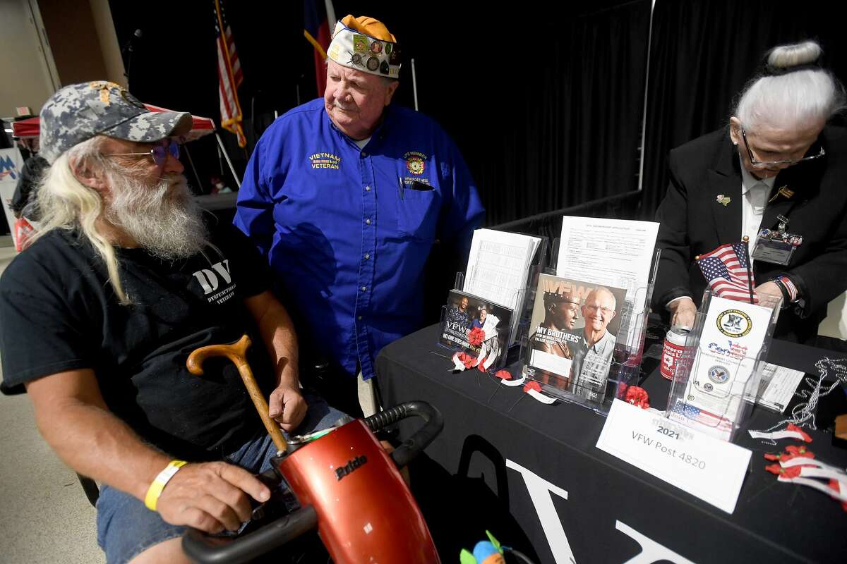 VFW Post 4820 member Jim Rose talks with fellow veteran Robert Sanford during Southeast Texas Stand Down 2021 in Port Arthur Friday. Numerouse veterans organizations as well as other health and community action services filled the Bob A. Bowers Civic Center for the event, which aims to connect veterans and the homeless with needed resources. A fall event will be held in Beaumont. Photo made Friday, May 14, 2021 Kim Brent/The Enterprise