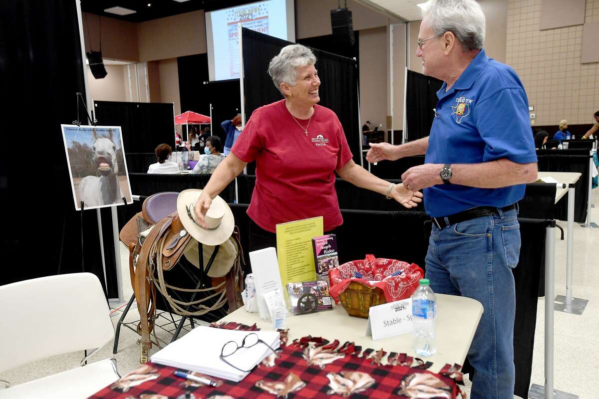 Katie Durio with Stable - Spirit talks with. James Seales of the Orange VFW during Southeast Texas Stand Down 2021 in Port Arthur Friday. Numerous veterans organizations as well as other health and community action services filled the Bob A. Bowers Civic Center for the event, which aims to connect veterans and the homeless with needed resources. A fall event will be held in Beaumont. Photo made Friday, May 14, 2021 Kim Brent/The Enterprise