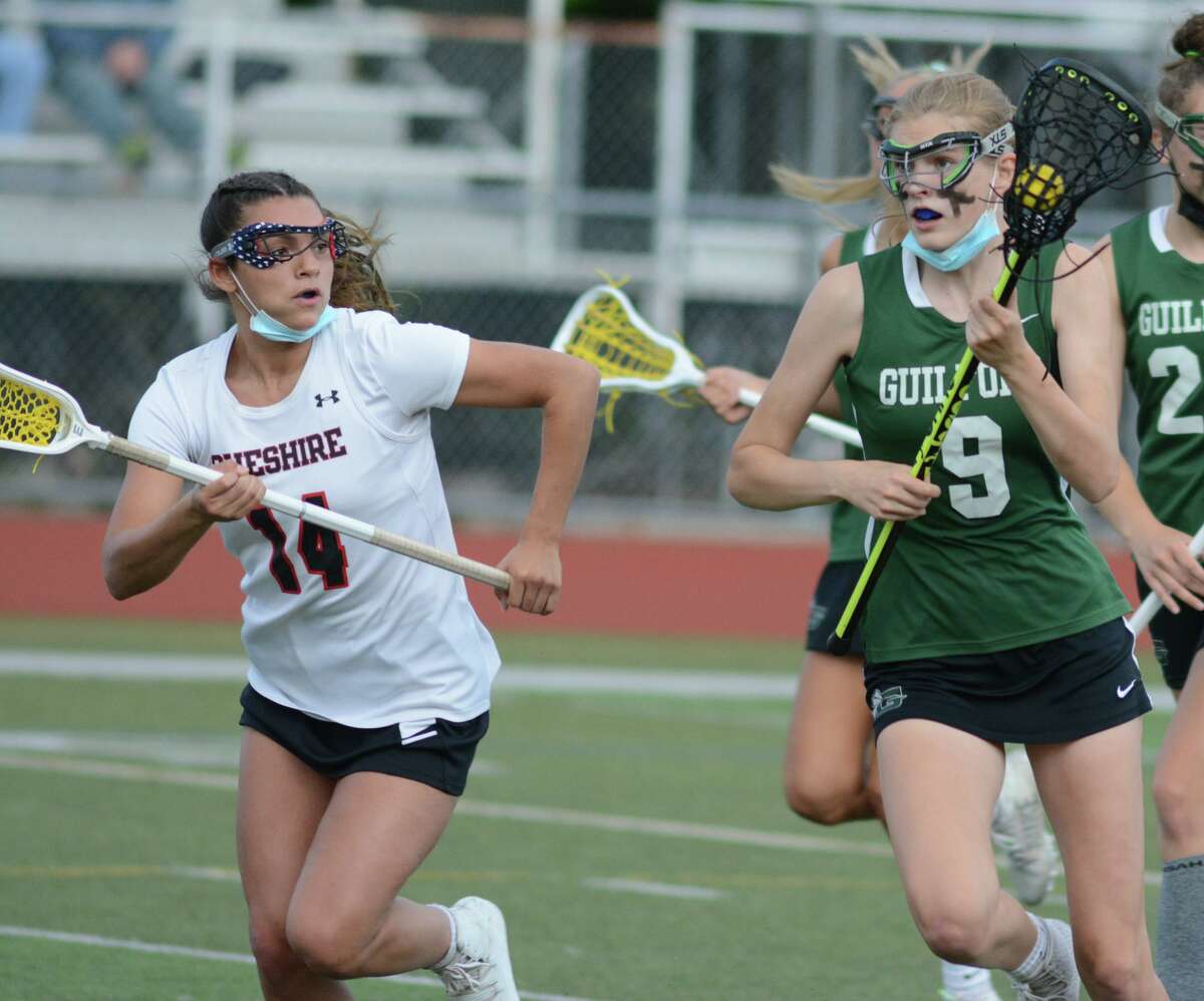 Guilford’s Lorelei King, right, is defended by Cheshire’s Ava Matikowski on Friday.