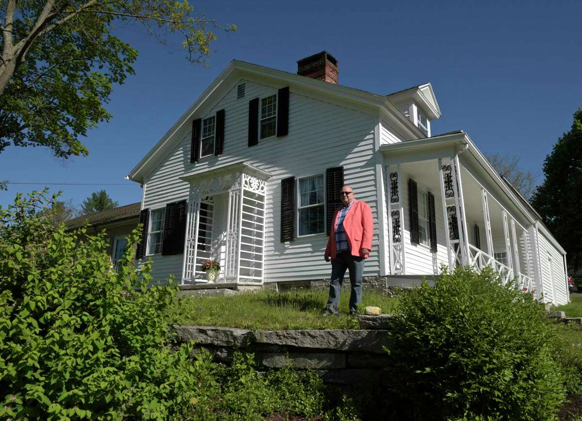 Ted Hine, of New Milford, stands in front of the Knapp House on Tuesday morning. Hine's family is one of the towns first families and he has live in New Milford his whole life. He has alway been a history buff and has started researching his families and the towns history for a book he is writing. May 11, 2021, in New Milford, Conn.
