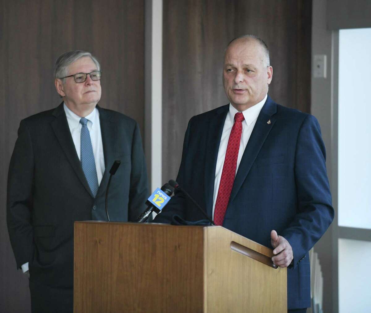Stamford Director of Public Safety Ted Jankowski, right, speaks beside Mayor David Martin at the Stamford Police Department in Stamford, Conn. Wednesday, May 12, 2021.