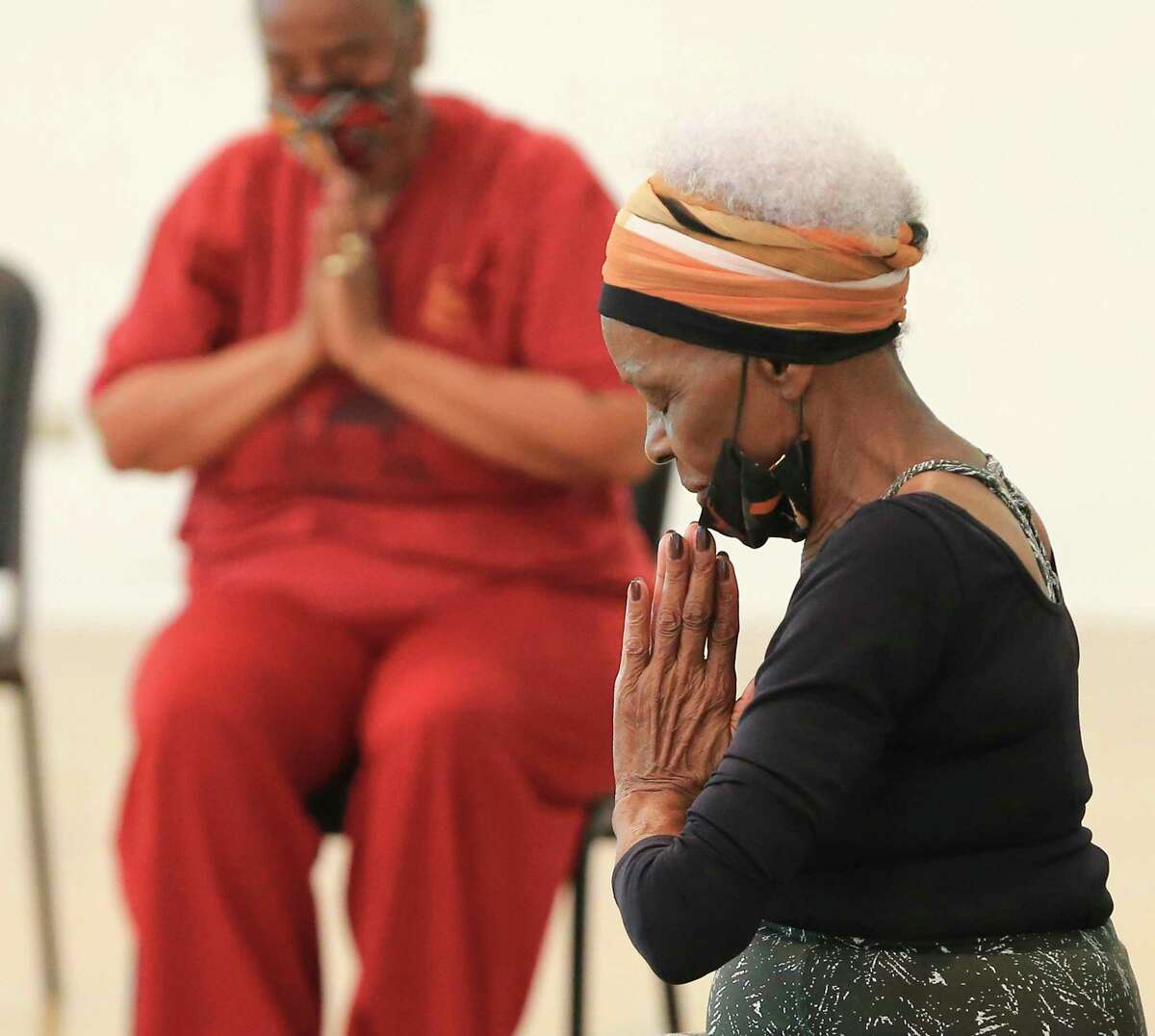 Gloria Lampley-Simmons, 85, leads East Side residents through chair yoga sessions on Monday, May 10, 2021. Lampley-Simmons has been volunteering her time to help others stay fit since 2004. The sessions take place at the Ella Austin Community Center, where Simmons sets up chairs in a circular, social distancing arrangement at the center's gym. The retired nurse also hosts yoga classes on Wednesday and Saturday mornings.