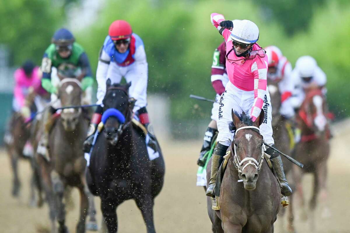 Rombauer, an 11-1 underdog, with jockey Flavien Prat on board, hold off Midnight Bourbon and Medina Spirit down the stretch to secure the first win in a Triple Crown race for trainer Mike McCarthy during the 146th running of the Preakness Stakes at Pimlico Race Course.