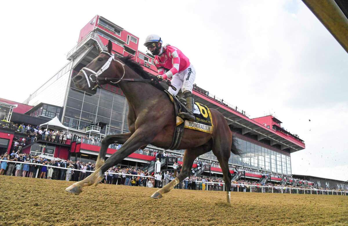Rombauer, an 11-1 underdog, with jockey Flavien Prat ride to victory at the 146th running of the Preakness Stakes at Pimlico Race Course on Saturday, May 15, 2021.