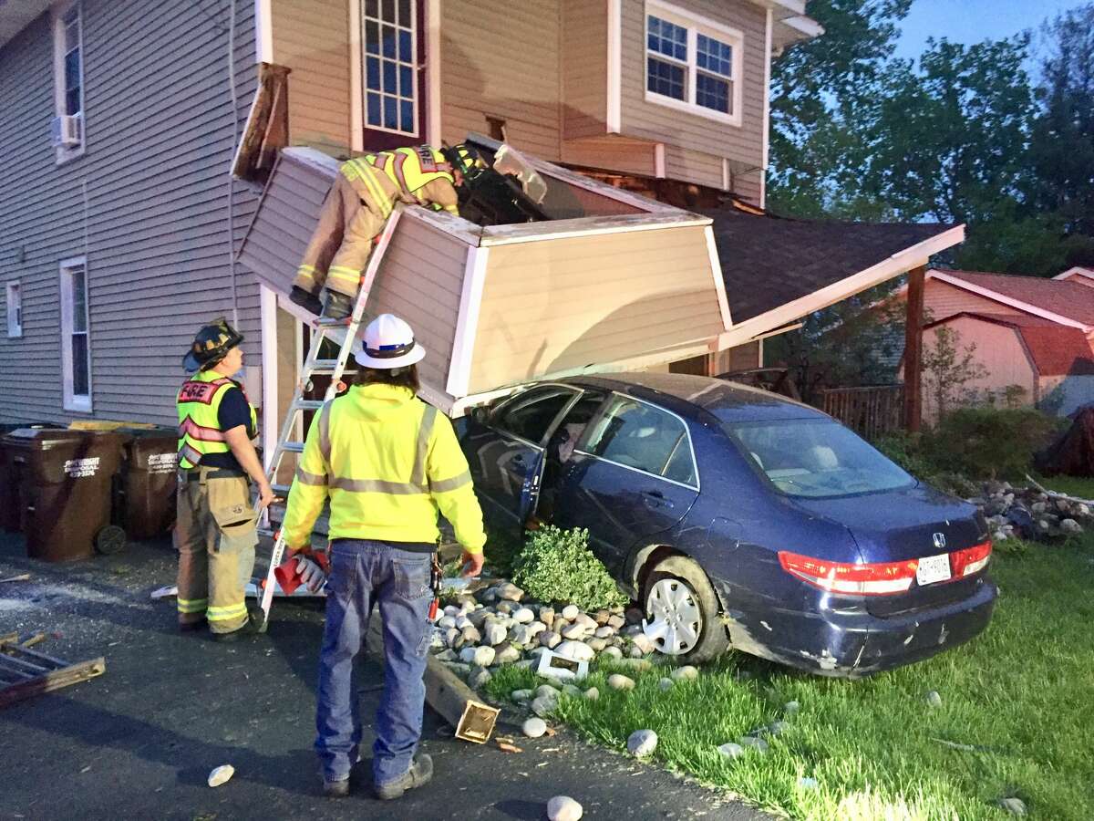 Police and firefighters responded to Corning Hill Road in Bethlehem Saturday, May 15, 2021 after a car crashed into a home, causing a support for a lower roof to collapse.