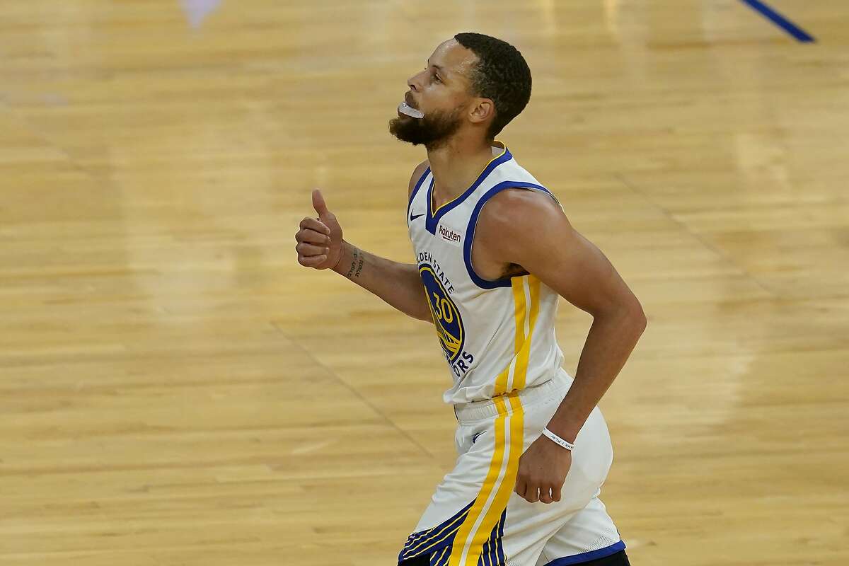 Golden State Warriors guard Stephen Curry runs up the court after scoring against the Memphis Grizzlies during the first half of an NBA basketball game in San Francisco, Sunday, May 16, 2021. (AP Photo/Jeff Chiu)