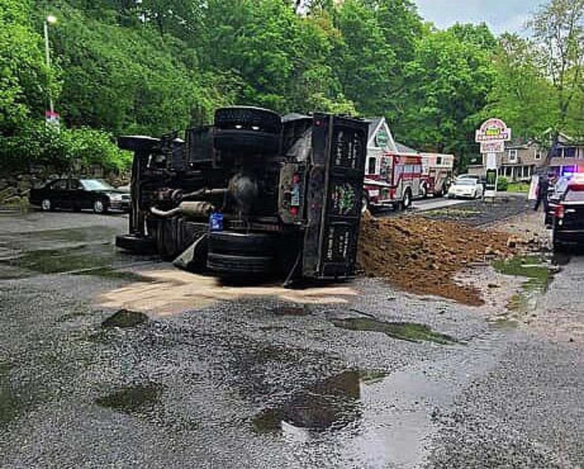 Police Overturned truck spilled soil across Naugatuck road