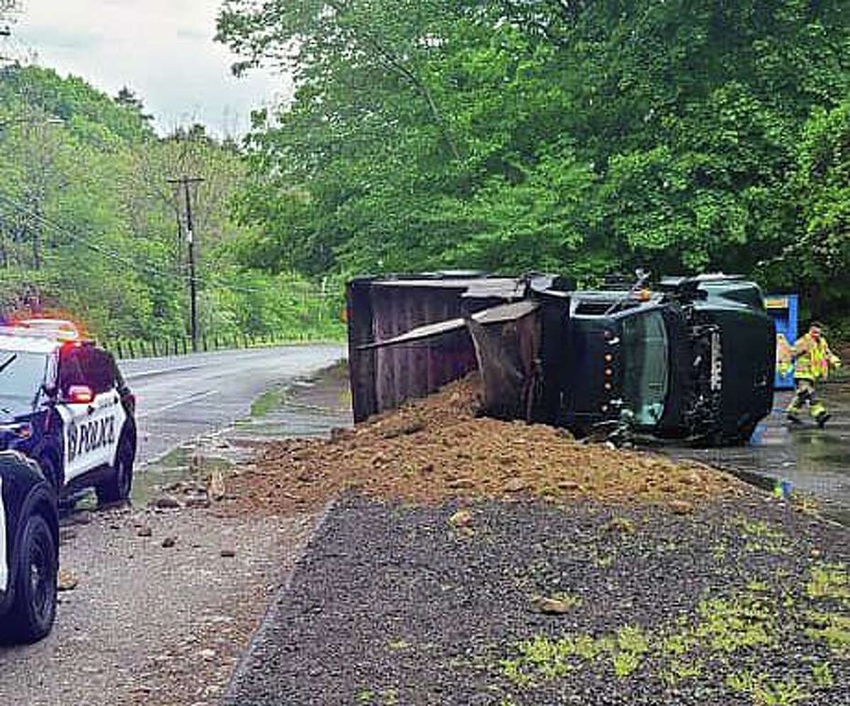 Police Overturned truck spilled soil across Naugatuck road