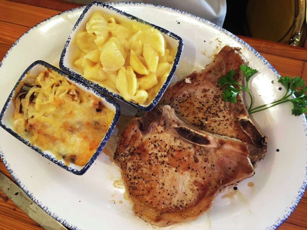 Pork chops with mac and cheese and cabbage au gratin at Mama's Cafe are some of the comfort foods patrons have grown to love.