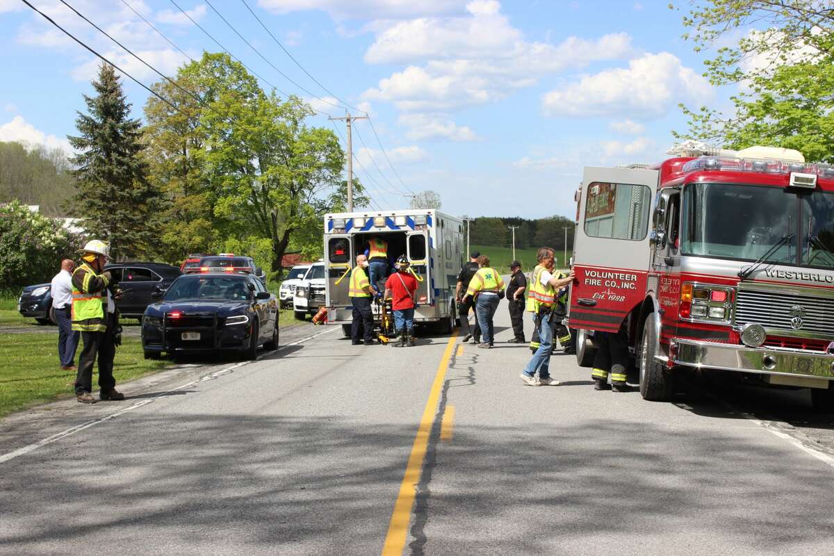 State Police and volunteer firefighters investigate the scene of a vehicle crash on Sunday, May 16, 2021, in Westerlo that sent several people to the hospital. One of the drivers was charged with driving while intoxicated and state troopers said additional charges were likely.