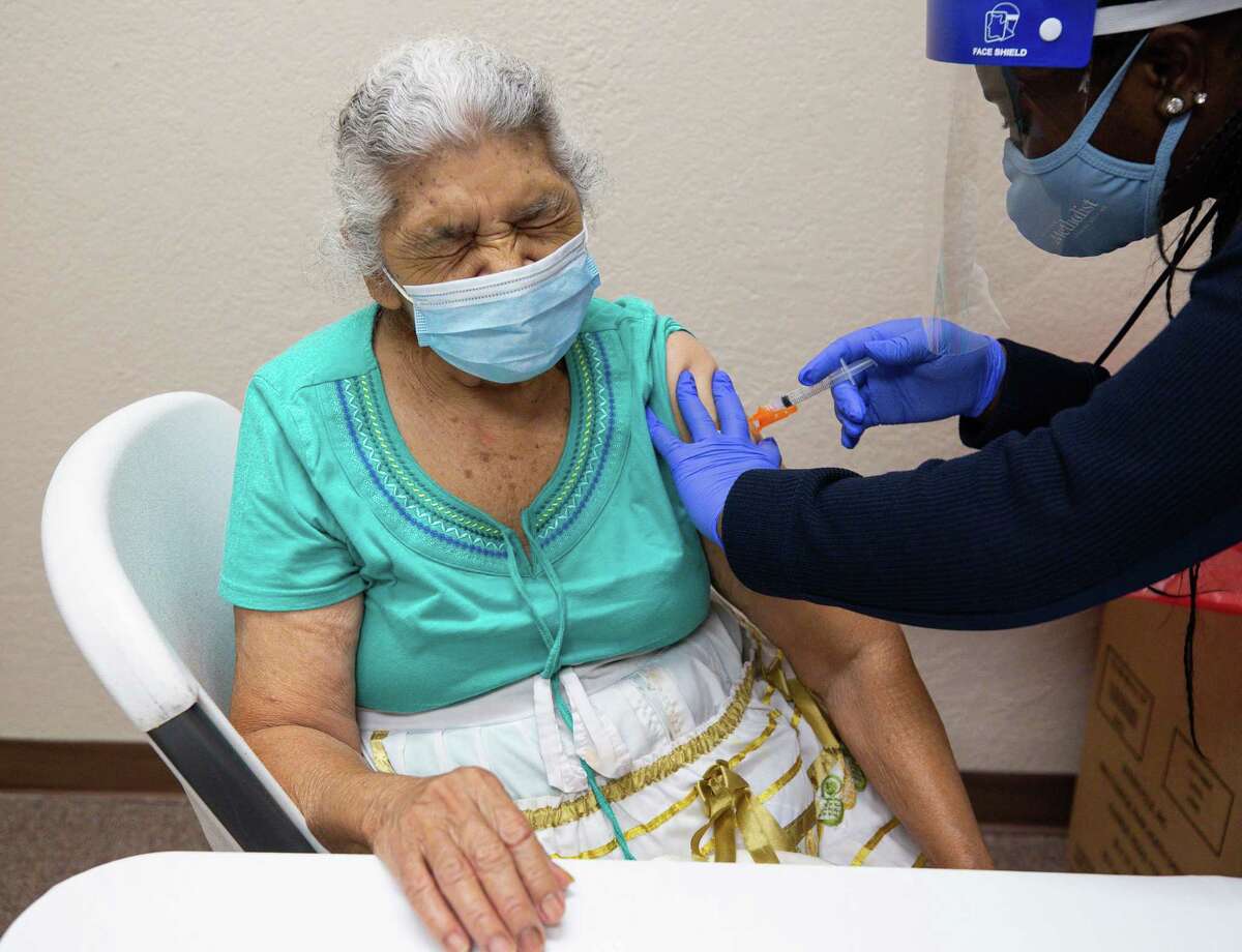 Gilma Saravia, 83, gets the Moderna COVID-19 vaccine at the Consulado General de El Salvador on Thursday, May 6, 2021, in Houston. Saravia said she waited so long to get the vaccine because her daughter - who she lives with - doesn't have a car and this is the closest a vaccination site has been to them. She said a friend called her daughter at 8 a.m. to tell them about the vaccination site.