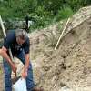 Jack Favors is one of many Hardin Co. residents preparing for the possibility of flooding by filling sand bags to protect homes and businesses. Torrential is rain in the forecast overnight and throughout the rest of the week.