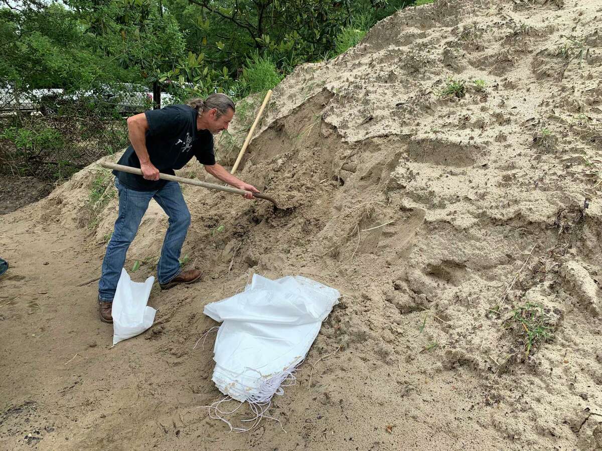 Jack Favors is one of many Hardin Co. residents preparing for the possibility of flooding by filling sand bags to protect homes and businesses. Torrential is rain in the forecast overnight and throughout the rest of the week.
