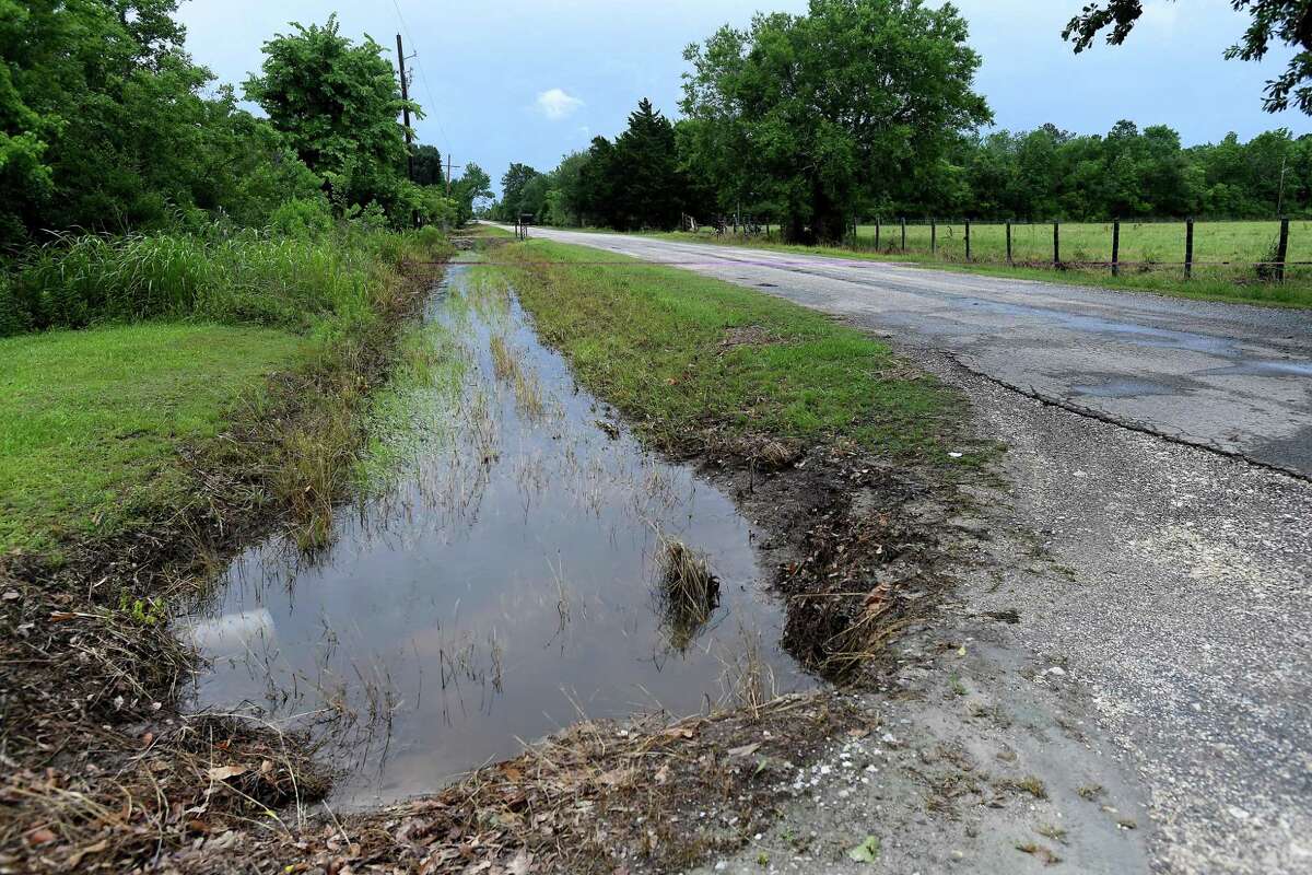 The drainage system into which the ditch behind Julie Meadows' home in Fannett should feed is well below flood stage, with little water movement evident Tuesday. Meadows' home and several properties on Boyt Road flooded after the area received over a foot of rainfall Monday. Photo made Tuesday, May 18, 2021 Kim Brent/The Enterprise