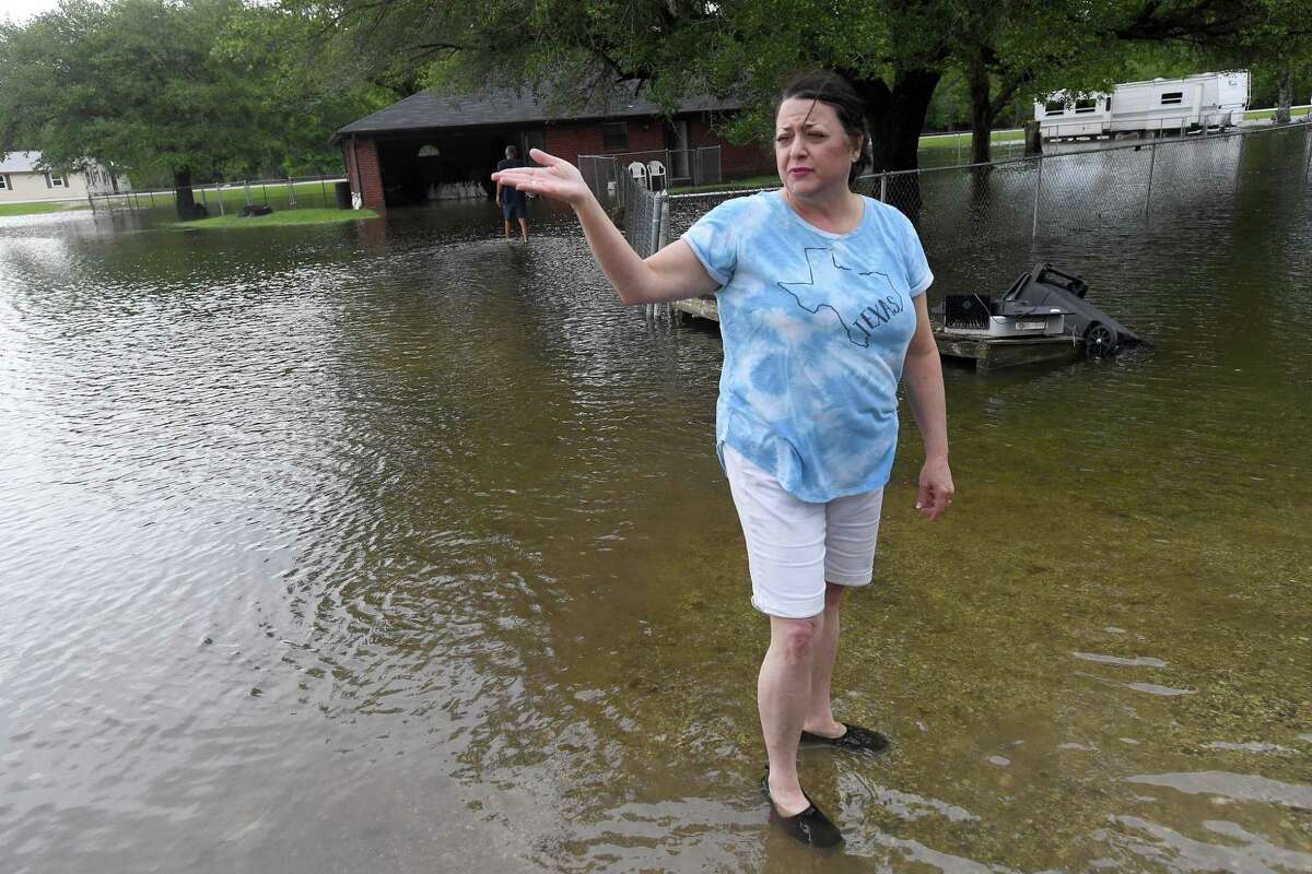 Lisa Brown got at least 2 inches of flooding inside her home along FM 365 in Fannett. The area received over a foot of rainfall Monday, flooding area bayous and several yards and homes surrounding Interstate 10, which was closed due to high water by late Monday. This is the third time Brown's home has flooded, pushinng her further toward the decision to move. Brown has lived there over 20 years. It's the only home her grown son, who lives in a trailer next door, has ever known, she said, so "there's a lot of sentimental value here. It's hard to let go." She and her husband will spend the remainder of the week at a second home under renovations in Silsbee and wait to decide about repairs after the system passes. She hopes that the predicted additional rainfall doesn't worsen their damage. "I guess we're going to sandbag and hope for the best," she said. Photo made Tuesday, May 18, 2021 Kim Brent/The Enterprise