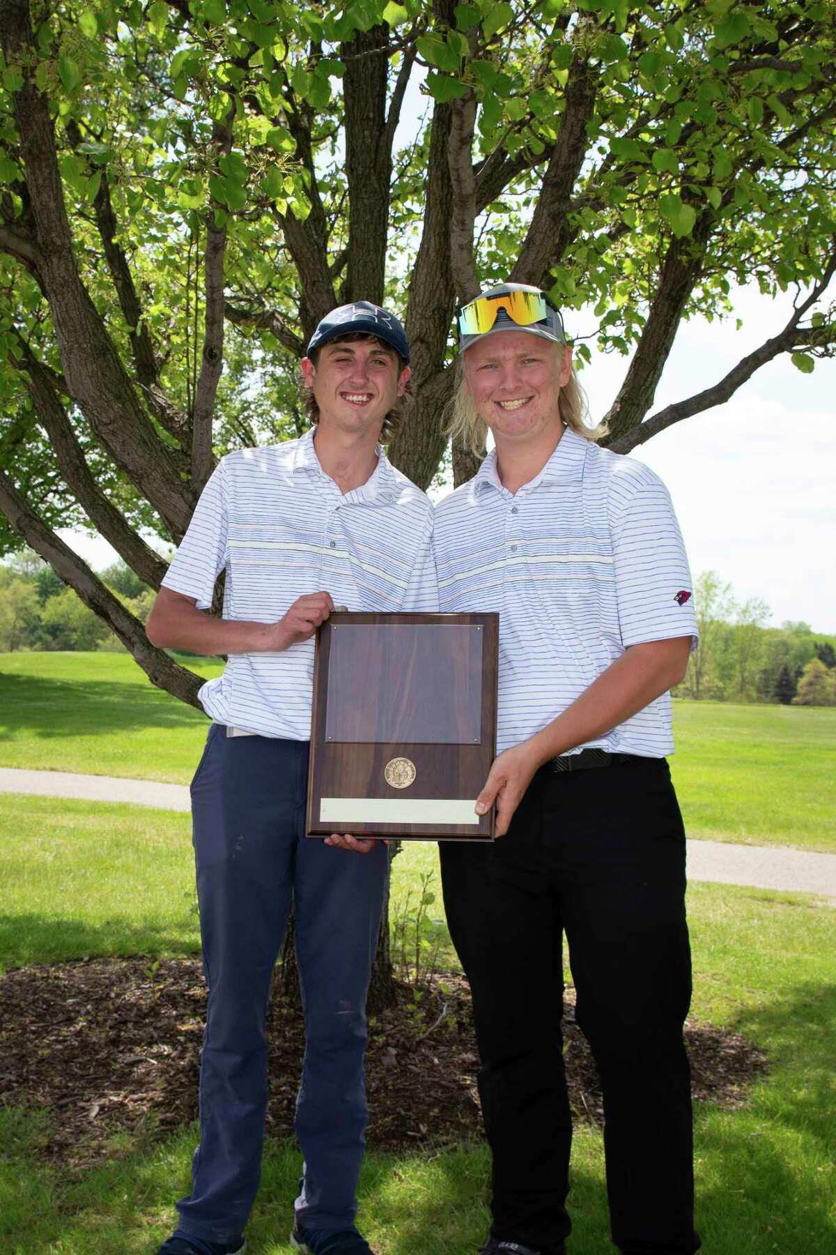 Big Rapids golfers Brett Lilienthal (left) and Dawson Currie celebrate winning the CSAA title for another year. (Courtesy photo)