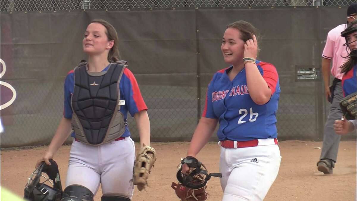 Coginchaug pitcher Kelly Boothroyd (26) and catcher Dana Boothroyd (10) after the Blue Devils’ win over North Branford on Tuesday.