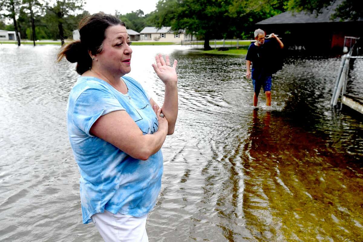 Lisa Brown got at least 2 inches of flooding inside her home along FM 365 in Fannett. The area received over a foot of rainfall Monday, flooding area bayous and several yards and homes surrounding Interstate 10, which was closed due to high water by late Monday. This is the third time Brown's home has flooded, pushinng her further toward the decision to move. Brown has lived there over 20 years. It's the only home her grown son, who lives in a trailer next door, has ever known, she said, so "there's a lot of sentimental value here. It's hard to let go." She and her husband will spend the remainder of the week at a second home under renovations in Silsbee and wait to decide about repairs after the system passes. She hopes that the predicted additional rainfall doesn't worsen their damage. "I guess we're going to sandbag and hope for the best," she said. Photo made Tuesday, May 18, 2021 Kim Brent/The Enterprise