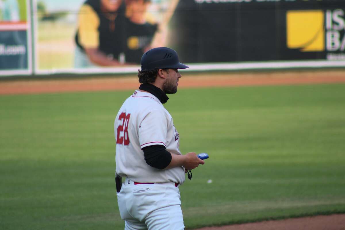 Loons manager Austin Chubb readies for the fourth inning against Lake County on May 18, 2021 at Dow Diamond.