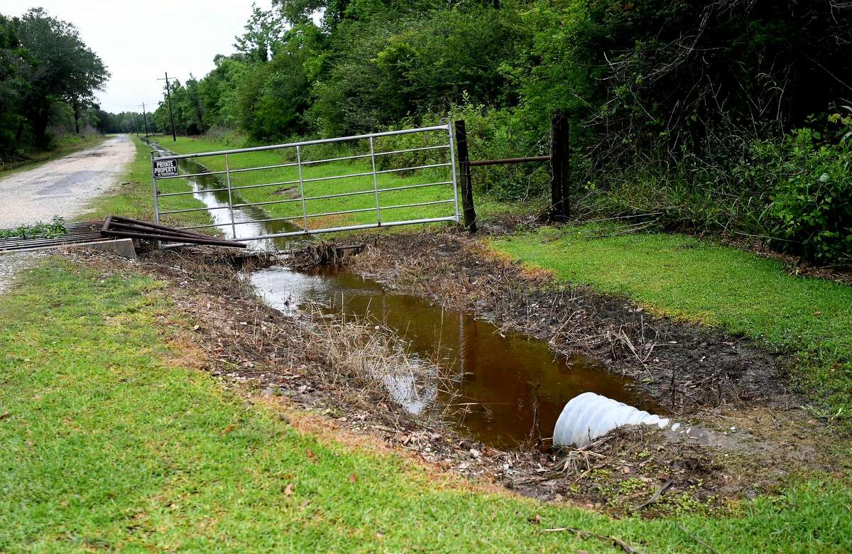 A drainage ditch feeding from that which runs behind West Clubb Road in Fannett is largely clear from flooding while properties all around it experienced flooding both in and outside their homes. The area received over a foot of rainfall Monday, flooding area bayous and several yards and homes. Photo made Tuesday, May 18, 2021 Kim Brent/The Enterprise