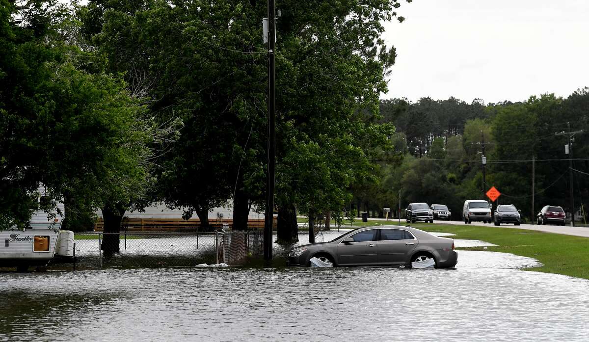 Flooding is seen in Fannett Tuesday. The area received over a foot of rainfall Monday, flooding area bayous and several yards and homes. Photo made Tuesday, May 18, 2021 Kim Brent/The Enterprise