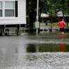 Flooding is seen in Fannett Tuesday. The area received over a foot of rainfall Monday, flooding area bayous and several yards and homes. Photo made Tuesday, May 18, 2021 Kim Brent/The Enterprise