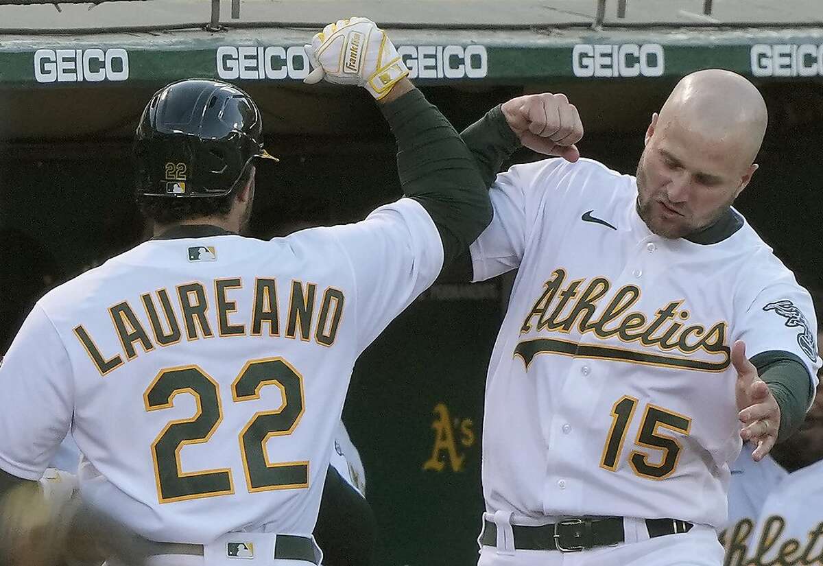 OAKLAND, CALIFORNIA - MAY 18: Ramon Laureano #22 of the Oakland Athletics is congratulated by Seth Browm #15 after hitting his second solo home run of the game against the Houston Astros in the fourth inning at RingCentral Coliseum on May 18, 2021 in Oakland, California. (Photo by Thearon W. Henderson/Getty Images)