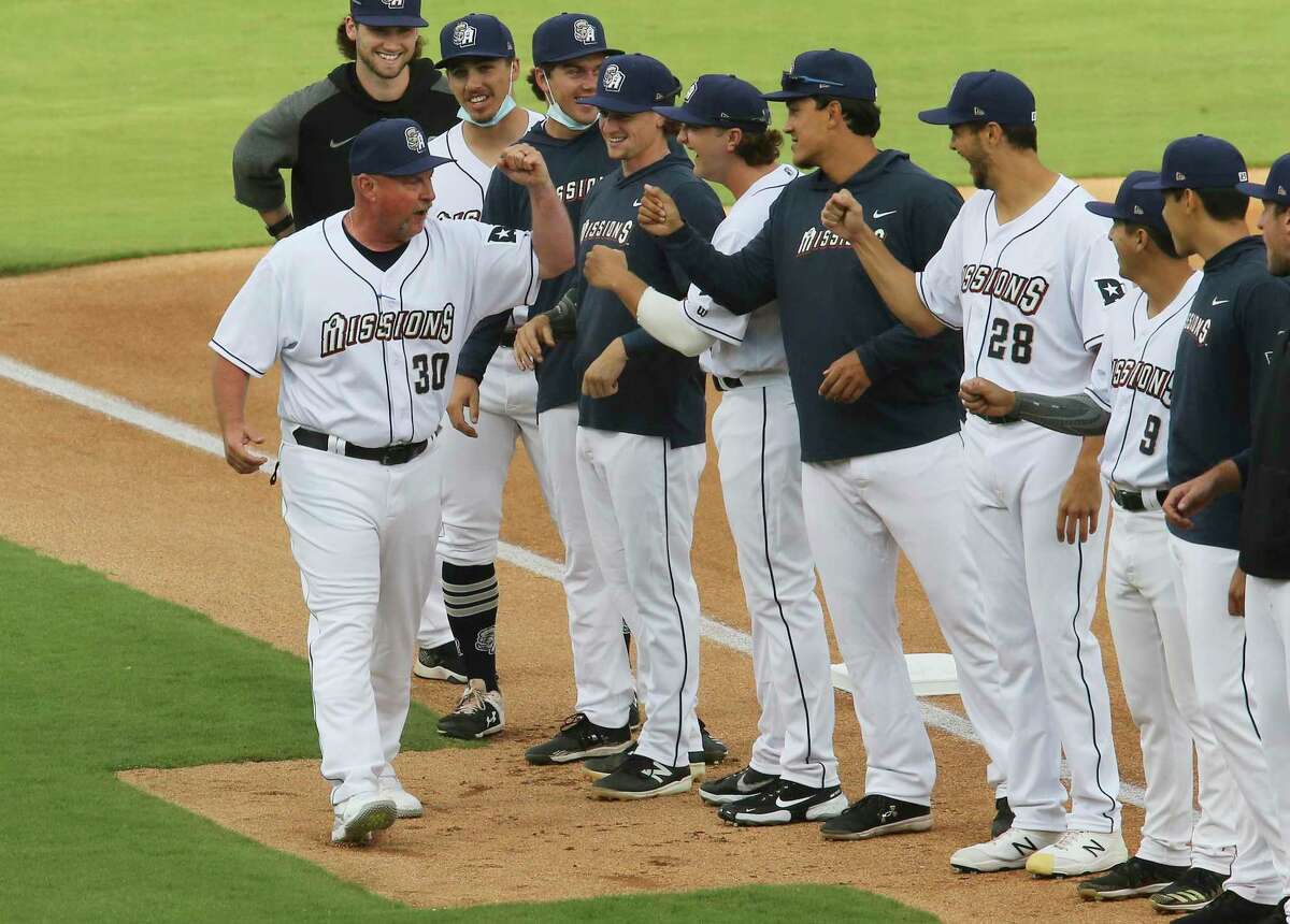 San Antonio Missions manager Phillip Wellman (30) greets his players before they play their season home opener against the Frisco Rough Riders at Wolff Stadium on Tuesday, May 18, 2021. Frisco defeated the Missions, 1-0.