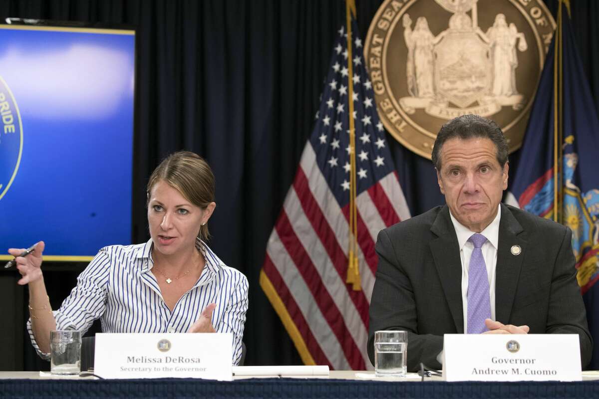 In this Sept. 14, 2018 file photo, Secretary to the Governor Melissa DeRosa, is joined by  Gov. Andrew Cuomo as she speaks to reporters during a news conference, in New York. DeRosa was the person behind a series of controversial phone calls that some county executives felt mixed politics with the state’s vaccine distribution efforts, according to a report released Tuesday. (AP Photo/Mary Altaffer, File)