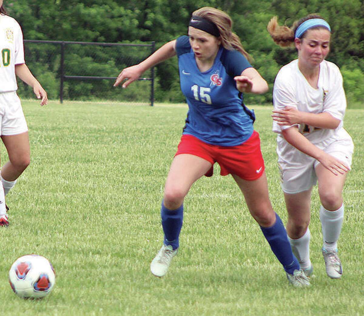 Gracie Reels (15) of Carlinville outraces a St. Thomas More player during the 2018 Class A Sectional final in Decatur. Reels, a three-sport standout at Carlinville, saw her senior season end prematurely when she tore an ACL early in the spring soccer season.