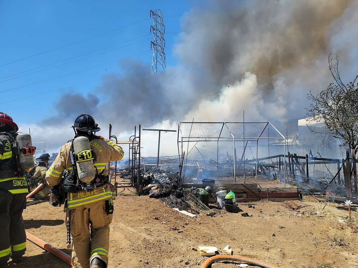 Firefighters battle a 2-alarm fire near Cambark Court in Martinez on Wednesday, May 19, 2021.