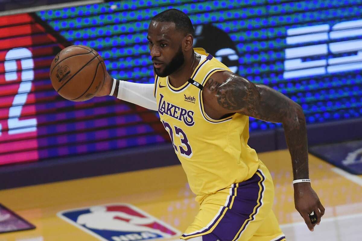 LeBron James #23 of the Los Angeles Lakers dribbles during the first half of an NBA Tournament Play-In game against the Golden State Warriors at Staples Center on May 19, 2021 in Los Angeles, California. 